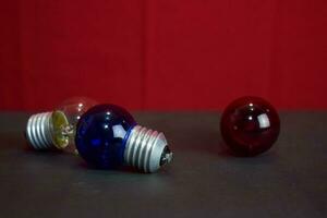 Close up lamp in red background and black table photo