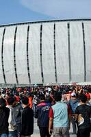 Crowds on Group of fans on the stadium Jakarta International Stadium. Jakarta, Indonesia, August 1, 2022 photo
