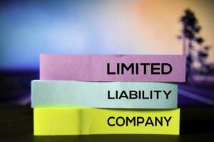 Limited Liability Company on the sticky notes with bokeh background photo