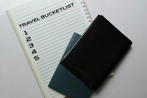 Passports and Travel Bucketlist write on a book isolated white background. holiday concept photo