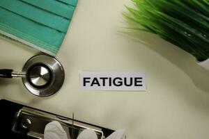 Fatigue with inspiration and healthcare medical concept on desk background photo