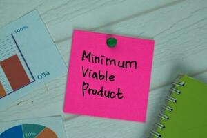 Minimum Viable Product write on sticky notes isolated on office desk. photo