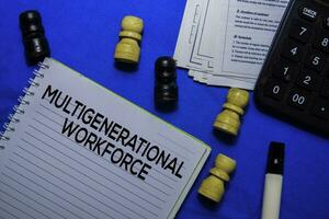 Multigenerational Workforce text on a book isolated on office desk. photo