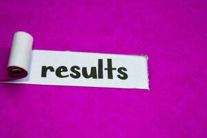 Results text, Inspiration, Motivation and business concept on purple torn paper photo