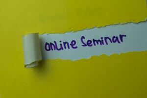 Online Seminar Text written in torn paper photo