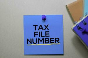 Tax File Number text on sticky notes isolated on office desk photo