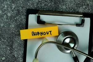 Burnout write on sticky notes on the table. Medical or Healthcare concept photo