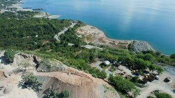 Aerial view of Extracting and transportation of rocks in a shale quarry. Central Sulawesi, Indonesia, March 3, 2022 photo