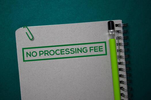 No Processing Fee write on a book isolated on green background. photo