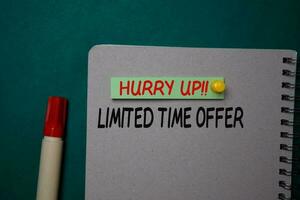 Hurry Up Limited Time Offer write on a sticky note isolated on green background. photo