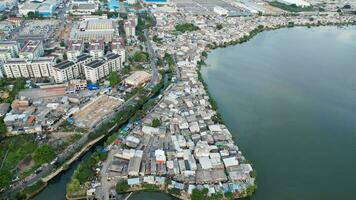 Aerial view of the Bright spring cityscape of Pluit port. Colorful sunset view of Jakarta, Indonesia. Beautiful Jakarta seascape. Traveling concept background. Jakarta, Indonesia, September 16, 2022 photo