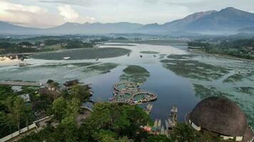 Aerial view of Situ Bagendit is a famous tourist spot in Garut with mountain view. Garut, Indonesia, May 19, 2022 photo