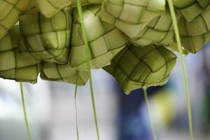 Ketupat asian rice dumpling. Ketupat is a natural rice casing made from young coconut leaves for cooking rice during eid Mubarak Eid ul Fitr photo