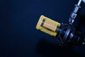 Close-up of retro microphone isolated on bokeh black background photo