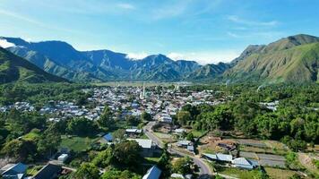 Aerial view of some agricultural fields in Sembalun. Sembalun is situated on the slope of mount Rinjani and is surrounded by beautiful green mountains. Lombok, Indonesia, March 22, 2022 photo