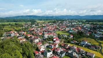 Aerial view of Traditional Minangkabau houses located in Bukittinggi, West Sumatra, Indonesia. Bukittinggi, Indonesia - January 25, 2023 photo
