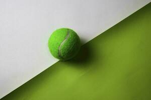 Tennis ball on top view office desk table of Business workplace and business objects. photo