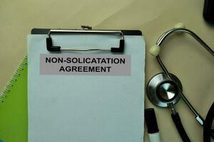 Non-Solicatation Agreement write on a paperwork isolated on office desk. photo