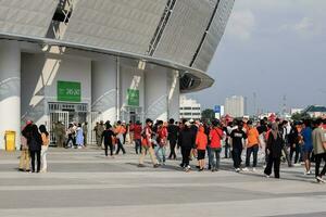 Crowds on Group of fans on the stadium Jakarta International Stadium. Jakarta, Indonesia, August 1, 2022 photo