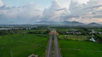 Aerial view of the city colorful Monument Tembolak Rainbow on Mataram. The newest icon from the city of Mataram Indonesia. Lombok, Indonesia, March 22, 2022 photo