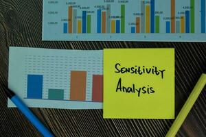Sensitivity Analysis write on sticky notes isolated on office desk. photo