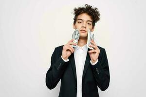 curly-haired guy in a suit black jacket self-confidence photo