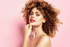 Woman portrait Curly hair, bare shoulders bright makeup photo