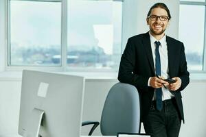 man in a suit near the desktop office computer Lifestyle photo