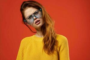 pretty woman in yellow sweater blue glasses fashion hairstyle photo