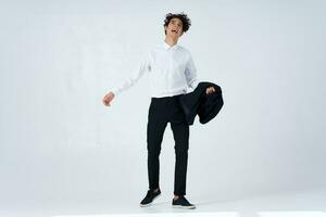 Cheerful man curly hair suit modern style fashion photo