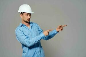 worker male engineer in white helmet emotions Professional photo