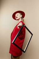 portrait of a woman frame in hand in red hat and jacket Lifestyle posing photo