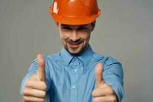 man in orange helmet blueprints builder isolated background photo