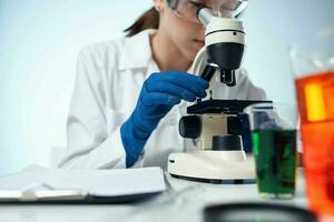 female laboratory assistant science research microbiology photo