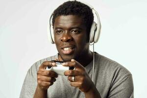 man african appearance with gamepad in hands playing entertainment technology photo