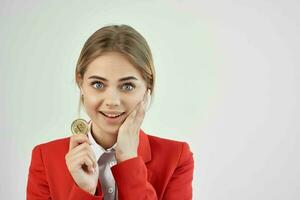 financier in a red jacket gold coin Bitcoin isolated background photo