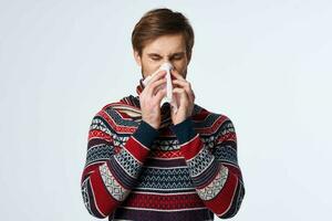 emotional man sweater health problems handkerchief flu infection studio photo