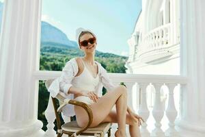 Attractive young woman wearing white shirt and towel on head while relaxing at home Mountain View photo