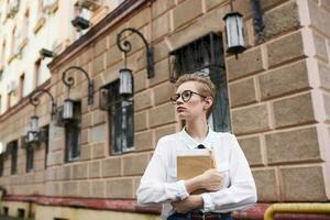 pretty woman with a book in his hands outdoors reading Lifestyle photo