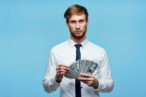 business man in shirt with tie bundle of money in the hands of the office photo