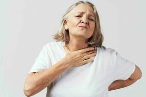 disgruntled elderly woman health problems pain treatment photo