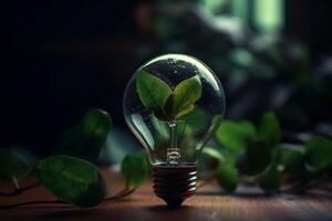 Glowing light bulb and green leaves on dark background. Idea concept photo