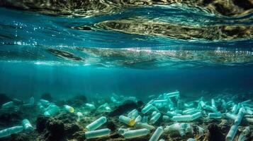 Underwater view of a PET bottles on the seabed. . photo