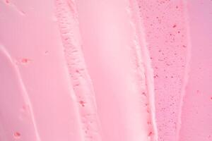 Strawberry ice cream close-up, smooth surface, texture, background. photo
