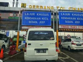 Cikampek, Indonesia in November 2022. The queue of cars that will enter the Cikampek Utama toll gate. photo