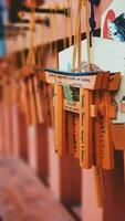 Kyoto, Japan in April 2019. Wish and prayer board or commonly called Ema. Ema are small wooden plaques, common in Japan, on which Shinto and Buddhist devotees write prayers photo