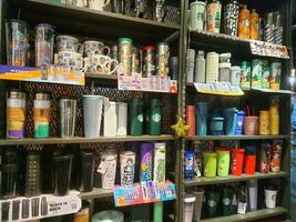 Jakarta, Indonesia in January 2022. Various types of Starbucks tumblers or drinking bottles are being sold and displayed in the shop windows. photo