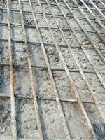 A series of iron bars arranged in such a way with a certain distance of two layers for the reinforcement of the concrete slab structure of the bridge. photo