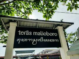 Yogyakarta, Indonesia in March 2022. Malioboro Terrace Teras Malioboro signage with Latin alphabet and Javanese letters photo