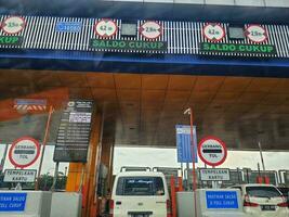 Cikampek, Indonesia in November 2022. The queue of cars that will enter the Cikampek Utama toll gate. photo